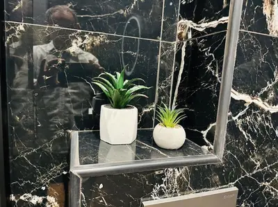 two plants sitting on a table in a bathroom at Port Brown Suite 1 in Piraeus