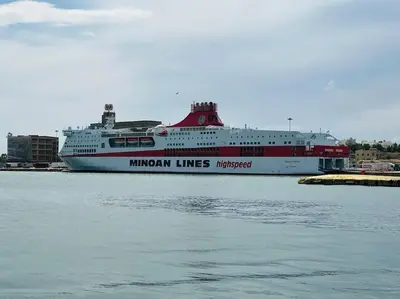 a large cruise ship is docked in a harbor at Port Brown Suite 1 in Piraeus