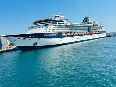 a cruise ship is docked in the water at Blue Suite at Piraeus Port in Piraeus