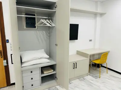 a room with a desk and a bed and a desk and a chair at Grey Suite at Piraeus Port in Piraeus