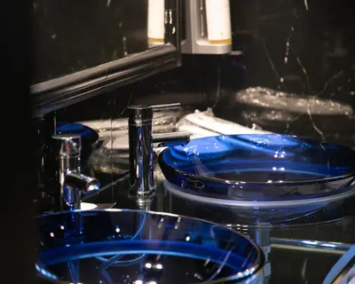 two blue dishes are sitting in a sink at Andromeda Suites in Athens