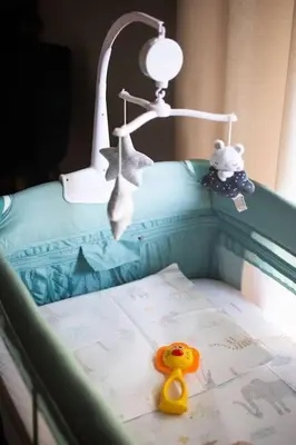 a toy duck sitting on a bed next to a lamp at Casa Almera in Athens