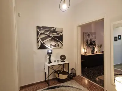 a room with a table and a picture on the wall at Modern apartment in Neo Faliro in Piraeus