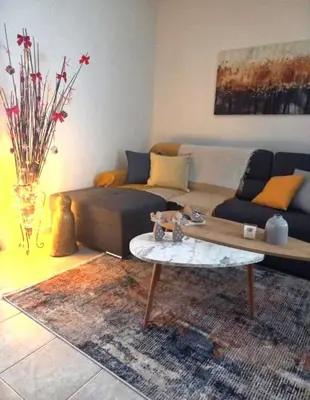 a living room with a couch and a coffee table at RELAX & RECHARGE apartment 1 in Athens