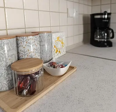 a kitchen counter with several containers and a bowl of food at RELAX & RECHARGE apartment 1 in Athens