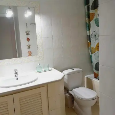 a bathroom with a sink and a toilet and a mirror at RELAX & RECHARGE apartment 1 in Athens
