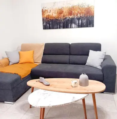 a living room with a couch and a coffee table at RELAX & RECHARGE apartment 1 in Athens