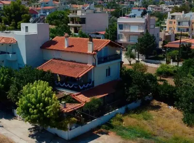 an overhead view of a house with red tile roofs at Betty s House Porto Rafti in Porto Rafti