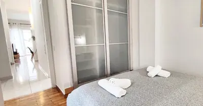 a room with two towels sitting on a bed at Διαμέρισμα στο Θησείο in Athens