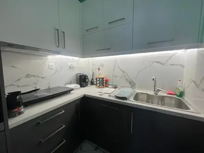 a kitchen with a sink and a counter top at Panos Loft With Acropolis View in Athens