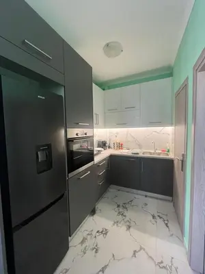 a kitchen with a black refrigerator and a sink at Panos Loft With Acropolis View in Athens