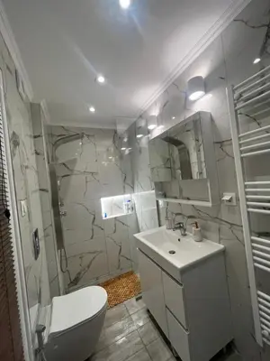 a bathroom with a toilet and a sink and a shower at Panos Loft With Acropolis View in Athens
