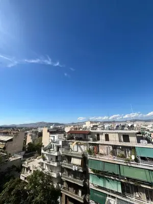 a view of a city from a building at Panos Loft With Acropolis View in Athens