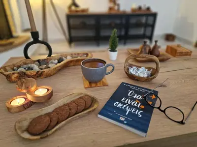 a table with a book and a plate of bread and candles at Daphnes Crown in Athens