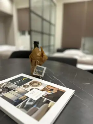 a table with a book and a picture on it at Estia Athens Apartment in Athens