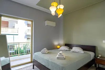 a bedroom with a bed with towels on it at Luxury 2 bed Urban Oasis in the Heart of Athens in Athens