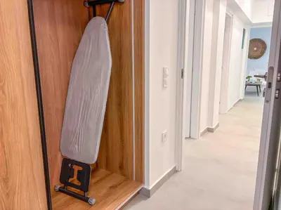 a sleeping bag in the corner of a room at Elegant Flat in Glyfada Center in Athens