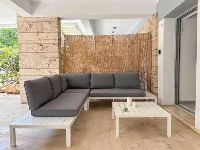 a living room with a couch and a coffee table at Elegant Flat in Glyfada Center in Athens