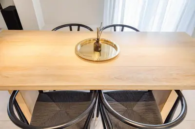 a wooden table with a bowl on top of it at Syntagma Luxe Loft in Athens