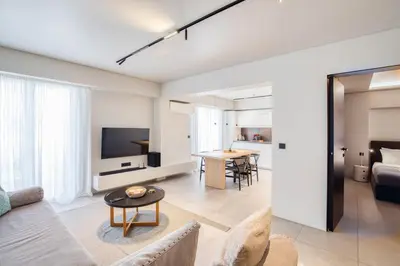 a living room with a couch and a table at Syntagma Luxe Loft in Athens