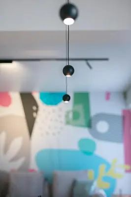 two lights hanging from a desk with a keyboard at Syntagma Luxe Loft in Athens