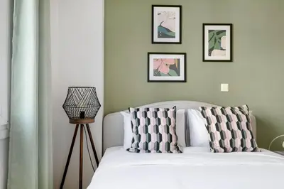a bedroom with a white bed with two pillows at Dew 1-Bedroom Apartment in Athens in Athens