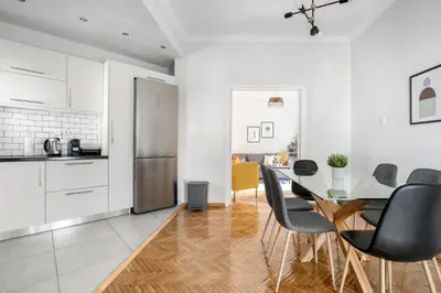 a kitchen and dining room with a table and chairs at Dew 1-Bedroom Apartment in Athens in Athens