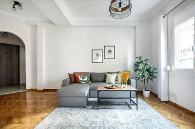 a living room with a couch and a table at Dew 1-Bedroom Apartment in Athens in Athens