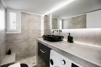 a bathroom with a sink and a mirror at Dew 1-Bedroom Apartment in Athens in Athens