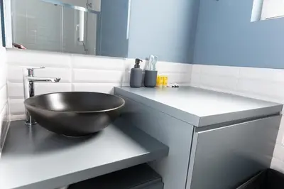 a bathroom with a bowl sink on a counter at Central apartment 5min from Omonoia Subway Station in Athens