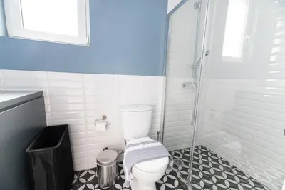 a bathroom with a toilet and a shower at Central apartment 5min from Omonoia Subway Station in Athens
