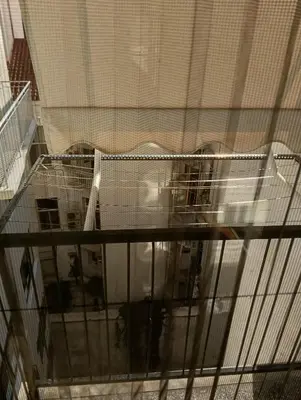 a view of a living room from a window of a house at Athens Apartment in Athens