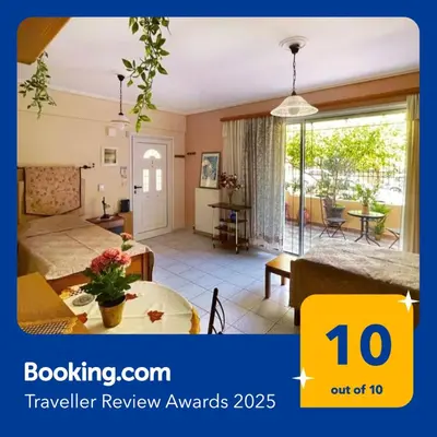 a hotel room with a bed and a table at Cosy Apartment with Garden 5 min from metro in Athens
