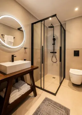 a bathroom with a sink and a shower at PAME Apartments Athens in Athens