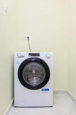 a washing machine is sitting in a room at AIOLOS elegant escapes kolonaki in Athens