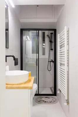 a bathroom with a sink and a toilet and a shower at AIOLOS elegant escapes kolonaki in Athens