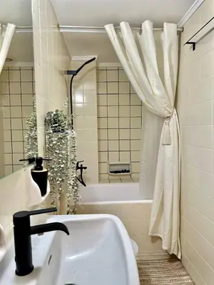 a bathroom with a sink and a bath tub at Arkadia`Kalithea in Athens