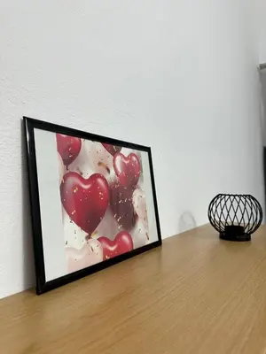 a framed picture of red hearts on a table at Arkadia`Kalithea in Athens
