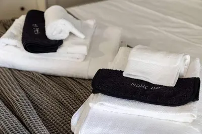 a couple of towels sitting on top of a bed at Miromar in Athens