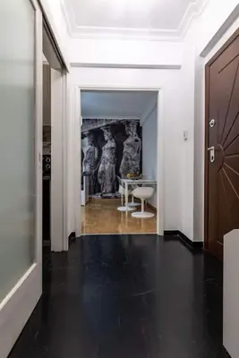 a hallway with a table in a room at Miromar in Athens