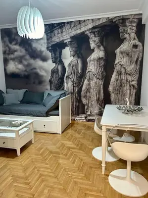 a room with a bed and a wall with a mural at Miromar in Athens