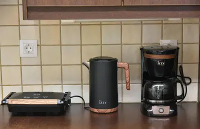 a coffeemaker and a coffee maker on a counter at Ifigenias Apartment-Near Acropolis-Koukaki in Athens