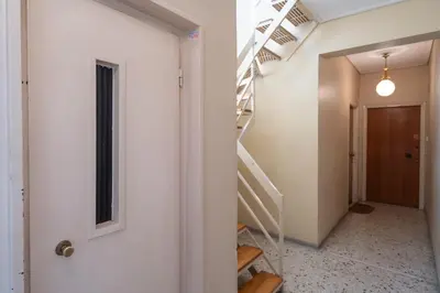 a hallway with stairs in a house at City View Penthouse with Large Terrace in Athens