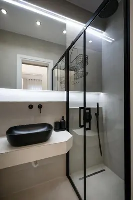 a bathroom with a black sink and a shower at Glyfada Golden Residence - 3 bedroom - Greecing in Athens