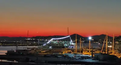 a group of boats in a marina at night at Sunny Athens flat near the sea 2 in Athens
