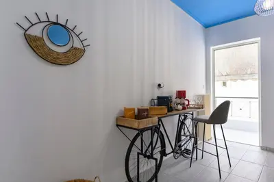 a bike parked next to a table in a room at Mesmerizing 2bedroom Luxury in Athens