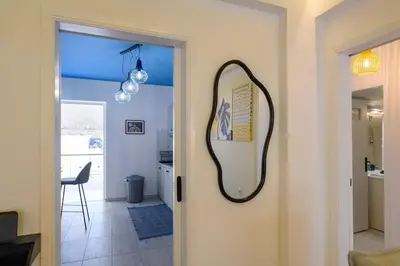 a mirror on the door of a room at Mesmerizing 2bedroom Luxury in Athens