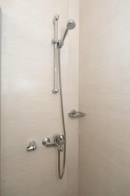 a shower with a shower head in a bathroom at Minimalist 2-Bedroom Apartment with Balcony in the Heart of Athens in Athens