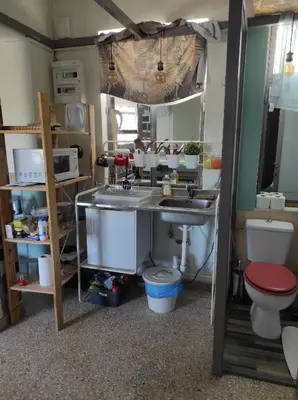 a bathroom with a sink and a toilet at Υπέροχη θέα in Athens