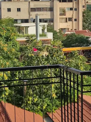 a view of a city from a balcony at Υπέροχη θέα in Athens